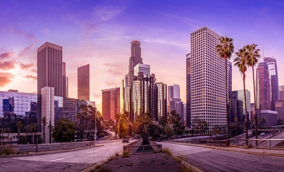 the skyline of los angeles during sunrise