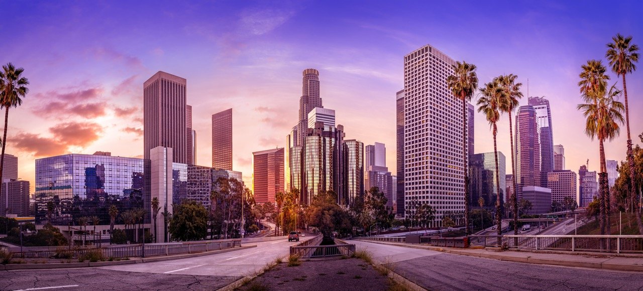 the skyline of los angeles during sunrise